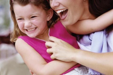 Smiling mother and young daughter