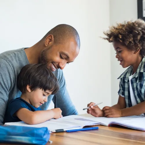 A father enjoys a visit with his children.