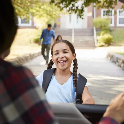 Mother picks up her daughter from school.